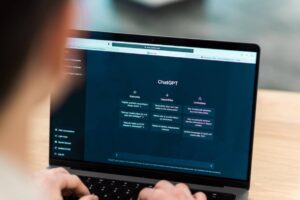 a person using chagpt on laptop .