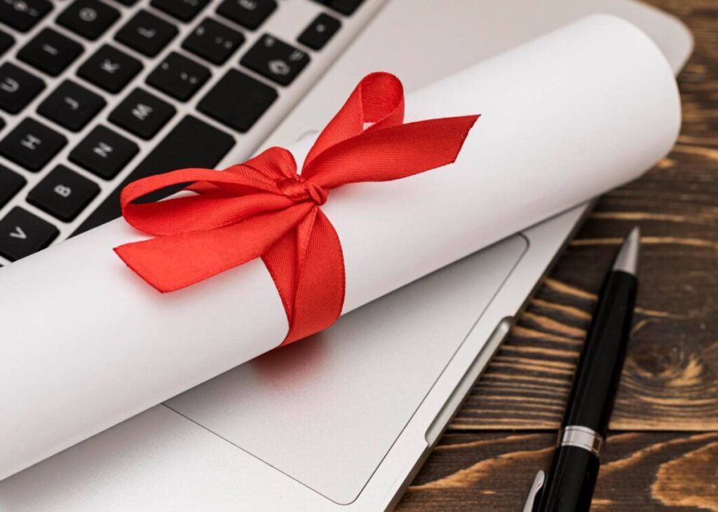 A white roll of paper tied with a red ribbon, elegantly presented for a gift or special occasion.